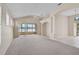 Open-concept living room with sunroom access and elegant architectural details at 4063 Caddie E Dr, Bradenton, FL 34203