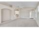Spacious living room with vaulted ceilings, neutral tones, and seamless transition into the kitchen area at 4063 Caddie E Dr, Bradenton, FL 34203
