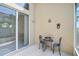 Patio with seating area is accessible from an adjacent room via sliding glass doors at 4063 Caddie E Dr, Bradenton, FL 34203