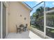 Outdoor patio with a seating area and lush tropical landscaping at 4063 Caddie E Dr, Bradenton, FL 34203