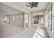 Connected sunroom with views into the residence and sliding glass doors that lead to the main living area at 4063 Caddie E Dr, Bradenton, FL 34203