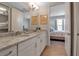 Double vanity bathroom with view into bedroom and walk-in shower at 376 Aruba Cir # 301, Bradenton, FL 34209