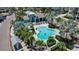 Relaxing community pool with surrounding tropical landscaping at 376 Aruba Cir # 301, Bradenton, FL 34209