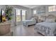 Guest bedroom with twin beds and large windows at 376 Aruba Cir # 301, Bradenton, FL 34209