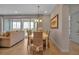 Elegant dining room with a table, chairs, and view to living room at 376 Aruba Cir # 301, Bradenton, FL 34209