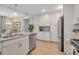 Modern kitchen with white cabinets, granite countertops and stainless steel appliances at 376 Aruba Cir # 301, Bradenton, FL 34209