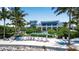 Beachfront clubhouse with pool and lounge chairs at 376 Aruba Cir # 301, Bradenton, FL 34209