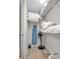 Linen closet with shelving for storage and a built-in ironing board at 376 Aruba Cir # 301, Bradenton, FL 34209