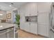 White shaker cabinets and granite countertops offer ample storage at 376 Aruba Cir # 301, Bradenton, FL 34209