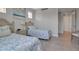 Guest bedroom with twin beds and light decor at 376 Aruba Cir # 301, Bradenton, FL 34209