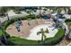 Circular playground with slide, climbing equipment, and sand at 376 Aruba Cir # 301, Bradenton, FL 34209