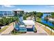 Community entrance with guardhouse, lush landscaping, and waterfront views at 376 Aruba Cir # 301, Bradenton, FL 34209