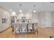Modern kitchen with island, stainless steel appliances, and white cabinetry at 376 Aruba Cir # 301, Bradenton, FL 34209