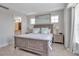 King-size bed and ensuite bathroom access in this bright bedroom at 376 Aruba Cir # 301, Bradenton, FL 34209