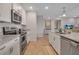 Modern kitchen with stainless steel appliances and granite countertops at 376 Aruba Cir # 301, Bradenton, FL 34209