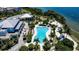 Resort-style pool with lounge chairs and waterfront access at 376 Aruba Cir # 301, Bradenton, FL 34209