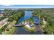 Scenic waterfront pathway with lush landscaping and tranquil views at 376 Aruba Cir # 301, Bradenton, FL 34209