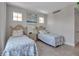 Guest bedroom with twin beds and coastal decor at 376 Aruba Cir # 301, Bradenton, FL 34209