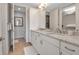 Double vanity bathroom with granite countertops and a walk-in shower at 376 Aruba Cir # 301, Bradenton, FL 34209
