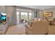 Bright living room with access to balcony and dining area at 376 Aruba Cir # 301, Bradenton, FL 34209