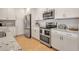 Modern kitchen with stainless steel appliances and white cabinets at 376 Aruba Cir # 301, Bradenton, FL 34209