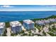 Aerial view of a luxurious waterfront community with upscale homes and a bay view at 376 Aruba Cir # 301, Bradenton, FL 34209