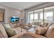 Relaxing living room with access to balcony and large TV at 376 Aruba Cir # 301, Bradenton, FL 34209