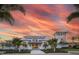 Community clubhouse with a beautiful sunset in the background at 376 Aruba Cir # 301, Bradenton, FL 34209