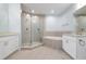 Elegant bathroom with double sinks, soaking tub, and a walk-in shower at 3426 79Th Street W Cir # 202, Bradenton, FL 34209