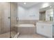 Modern bathroom with a soaking tub and walk-in shower at 3426 79Th Street W Cir # 202, Bradenton, FL 34209