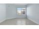 Well-lit bedroom featuring tiled floors and a window at 3426 79Th Street W Cir # 202, Bradenton, FL 34209