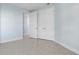 Spacious bedroom with double doors and light-blue walls at 3426 79Th Street W Cir # 202, Bradenton, FL 34209