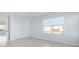 Spacious bedroom with light blue walls and tiled floors at 3426 79Th Street W Cir # 202, Bradenton, FL 34209