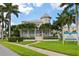 Inviting community clubhouse with palm trees and landscaping at 3426 79Th Street W Cir # 202, Bradenton, FL 34209
