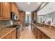 Modern kitchen with granite countertops and wood cabinets at 3426 79Th Street W Cir # 202, Bradenton, FL 34209