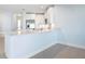 White kitchen with an island and stainless steel appliances at 3426 79Th Street W Cir # 202, Bradenton, FL 34209