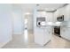 White kitchen with island and stainless steel appliances at 3426 79Th Street W Cir # 202, Bradenton, FL 34209
