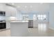 Modern kitchen featuring white cabinets, a kitchen island, and stainless steel appliances at 3426 79Th Street W Cir # 202, Bradenton, FL 34209