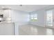 Open concept kitchen with white cabinets and tile floor at 3426 79Th Street W Cir # 202, Bradenton, FL 34209
