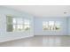 Bright living room with large windows and tile floor at 3426 79Th Street W Cir # 202, Bradenton, FL 34209