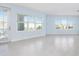 Spacious living room with light walls, tile floors, and access to a balcony at 3426 79Th Street W Cir # 202, Bradenton, FL 34209