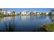 Community pond with a fountain and reflecting buildings at 3426 79Th Street W Cir # 202, Bradenton, FL 34209