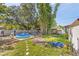 Backyard with a small pool and playset at 512 1St E Ave, Bradenton, FL 34208