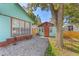 Home with a detached studio and gravel driveway at 512 1St E Ave, Bradenton, FL 34208