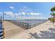 Scenic riverwalk path with bridge views and lush landscaping at 512 1St E Ave, Bradenton, FL 34208