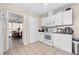 Bright kitchen, white cabinets, granite counters at 512 1St E Ave, Bradenton, FL 34208