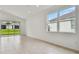 Bright living room with tile flooring and sliding glass doors at 5289 Cappleman Loop, Brooksville, FL 34601