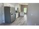 Modern kitchen with stainless steel appliances and gray flooring at 11261 3Rd Ave, Punta Gorda, FL 33955