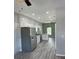 Modern kitchen with stainless steel appliances and white cabinetry at 11261 3Rd Ave, Punta Gorda, FL 33955