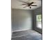 Spacious bedroom with wood-look floors and ceiling fan at 11261 3Rd Ave, Punta Gorda, FL 33955
